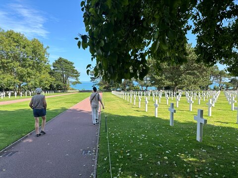 grandmother and grandson visiting American cemetery from WWII