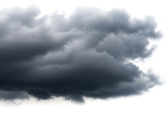 Obraz premium A dramatic close up of dark storm clouds filling the frame against a bright white background sky view