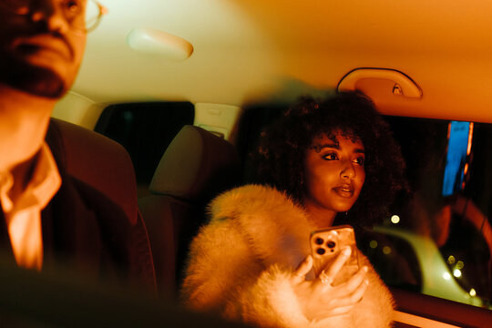 Young woman inside car night portrait