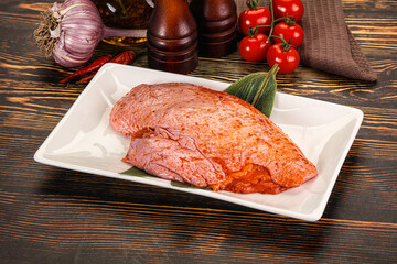 Raw marinated duck breast for cooking