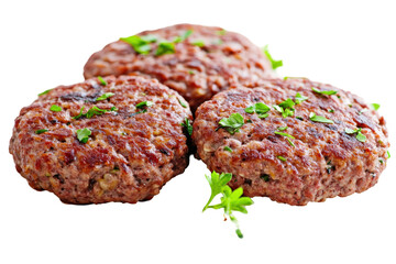 Juicy meat patties on black topped with fresh herbs