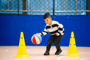 Chinese Boy in Basketball Class