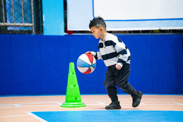 Chinese Boy in Basketball Class