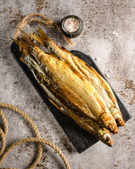 raw smoked fish on a blackboard