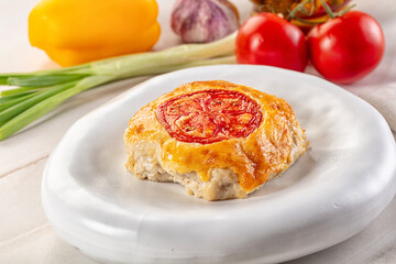 Chicken chop cutlet with cheese and tomato