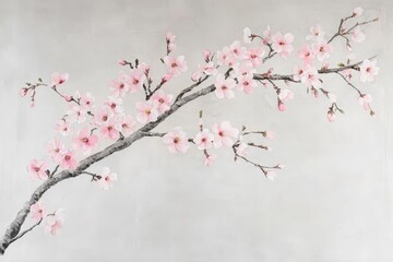 Delicate blossoms adorn a muted gray branch.