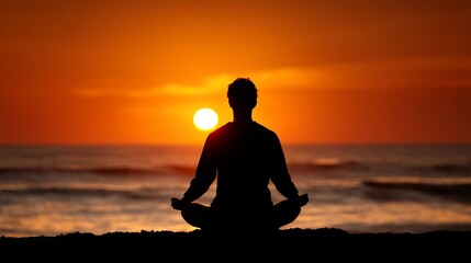 Silhouette of person meditating at sunrise over ocean; peaceful moment; perfect for relaxation or meditation posters; great background image for wellness or mindfulness products