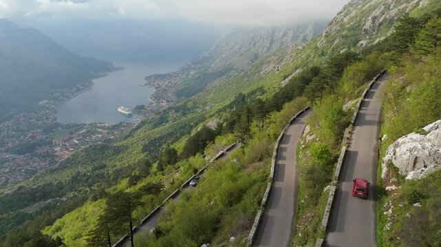Aerial drone Serpentine road Kotor UNESCO heritage mountains fog cloud forests Budva Bar Sveti Stefan Adriatic Mediterranean Europe 