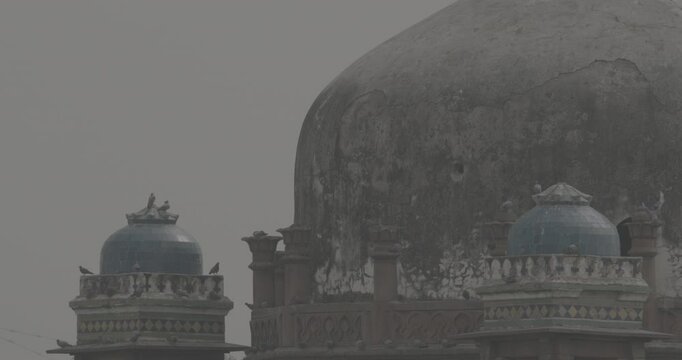 New Delhi, Delhi, India. Doves birds flying above Babur's Tomb near The Humayun's tomb. Famous place is Tomb of Mughal emperor, Mirza Nasir al-Din Muhammad commonly known as Humayun situated in Delhi