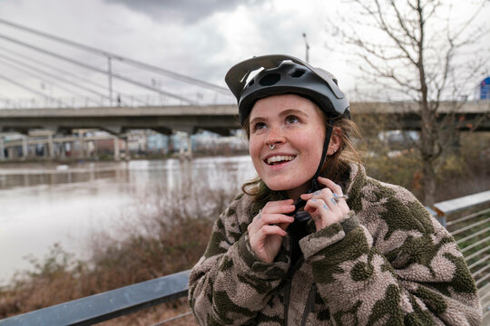 putting on bike helmet