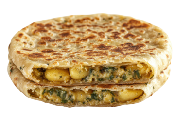 Stacked aloo paratha golden flatbread filled with spiced potatoes and spinach cut open to reveal the savory filling
