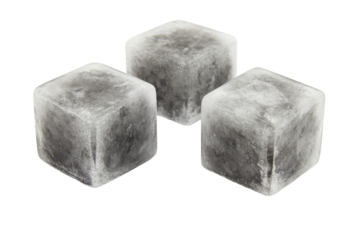 Three ice cubes glimmer against a black expanse their surfaces hinting at a frosty embrace