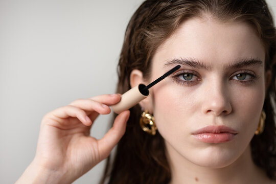 Woman applying eyelashes mascara