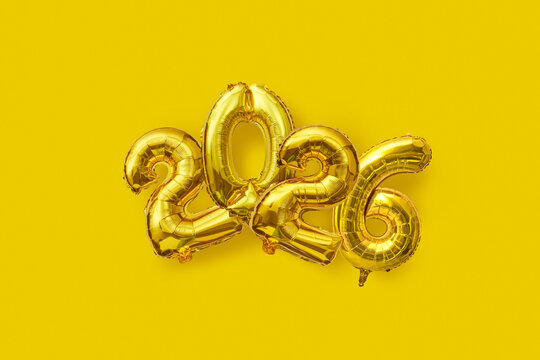 Gold 2026 Balloon Numbers on Yellow Background