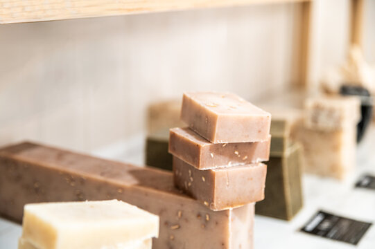 Natural handmade soaps displayed in a minimalist setting