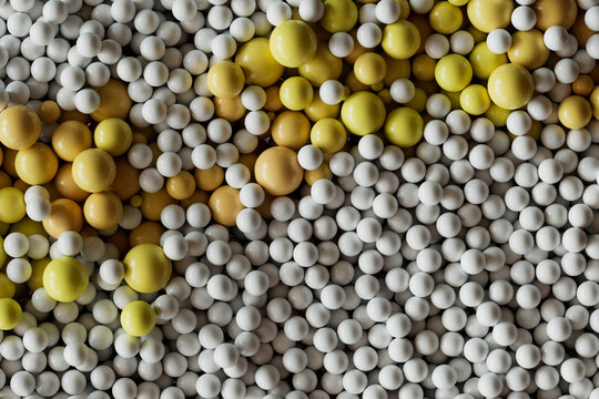  Beige and white plastic balls in abstract composition