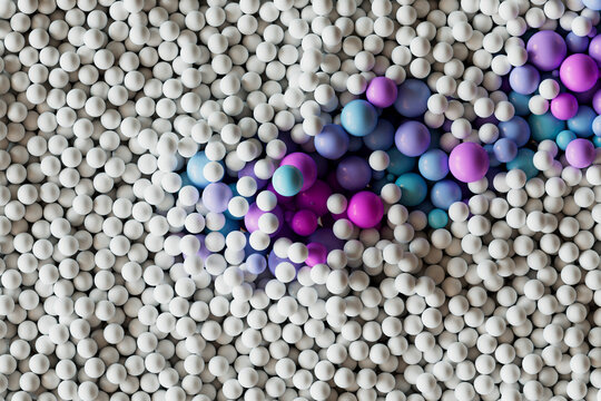  Yellow and white plastic balls arranged in a flowing pattern