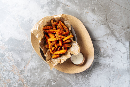  Sweet Potato Fries with Dipping Sauce on Stone Plate