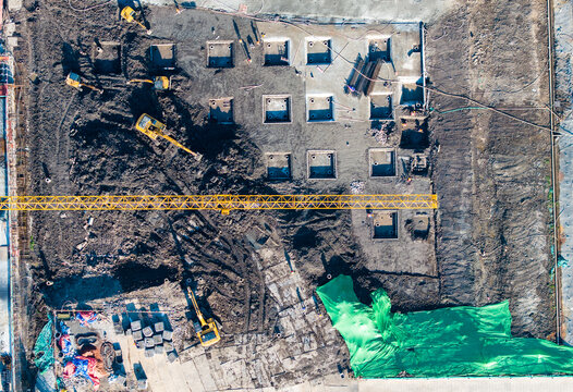 Vertical Aerial View of Four Excavators at Construction Site