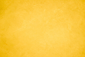 Yellow concrete stone texture for background in summer wallpaper. Cement and sand wall of tone vintage minimal. Concrete abstract wall of light yellow color, cement texture white blank for home decor.