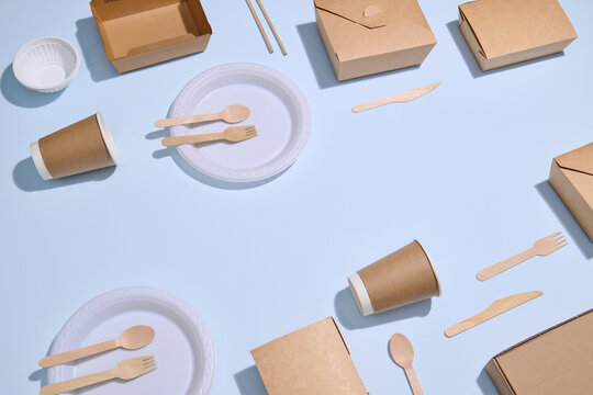 Eco-Friendly Disposable Plates, Cups, and Utensils on blue background