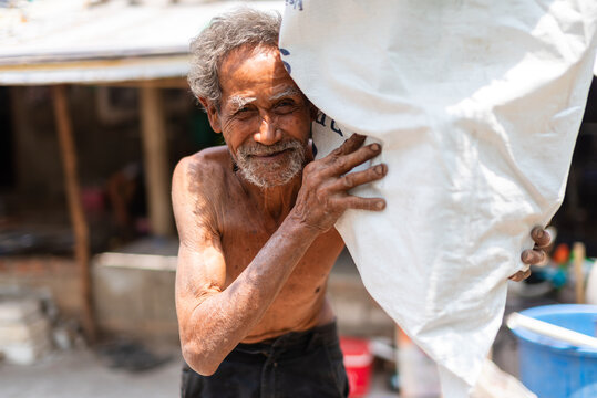 Elderly Man in Thai Low-Income Community