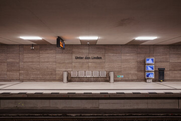The clean and modern platform of the U-Bahn Unter den Linden subway station in Berlin, Germany. 