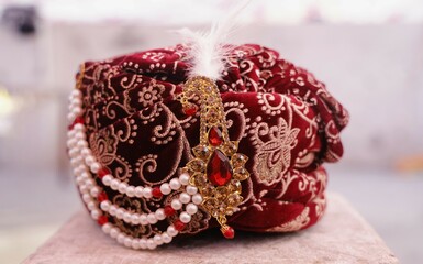 Ornate Maroon Wedding Turban with Intricate Gold Embroideries and Accents