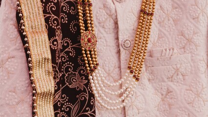 Ornate Wedding Sherwani with Decorative Embellishments in Gold and Pink Theme