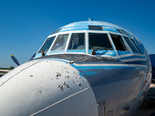 old airplane, open-air aviation museum, cockpit, ancient, windscreen, runway, pilot