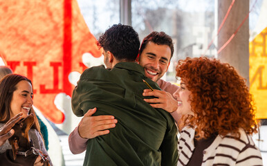 Friendly group celebrating a joyful moment together at the office