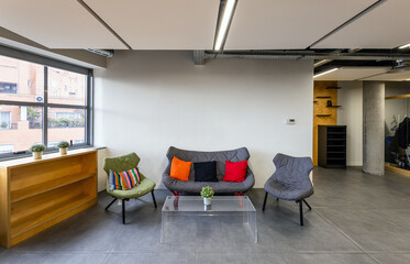 Modern office lounge with motivational wall art