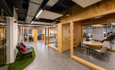 Modern office interior with natural light and wooden decor