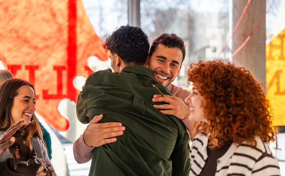 Friendly group celebrating a joyful moment together at the office