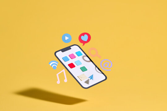 Paper cutouts of social media and communication icons float around