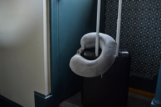Neck pillow on top of a suitcase
