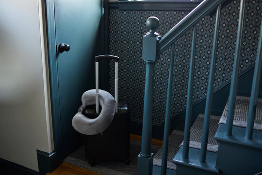 Neck pillow on top of a suitcase