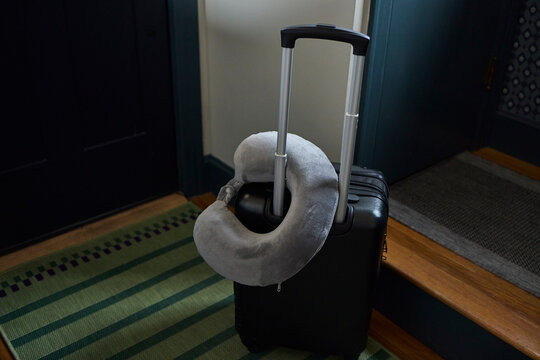 Neck pillow on top of a suitcase