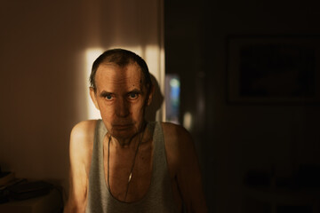 Senior man with shadow on his face ,great DOF ,selective focus