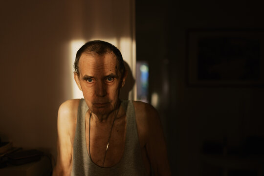 Senior man with shadow on his face ,great DOF ,selective focus