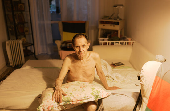 Senior man on the bed. 