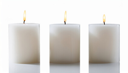 White candles on a wooden tray