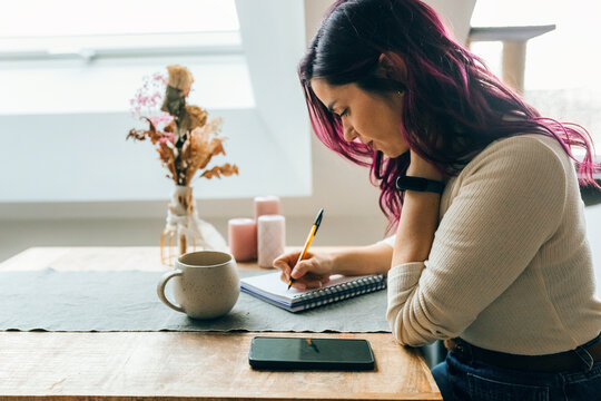 Woman journaling at home