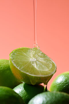 Close-up of a halved lime with sweet honey dripping onto it