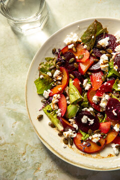 A light colourful salad lunch with a glass of water