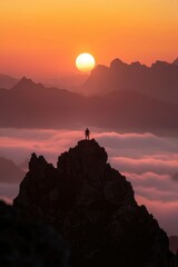 Fototapeta premium Person stands atop mountain peak overlooking clouds during a stunning sunset