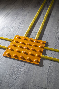 Tactile yellow tiles for the visually impaired