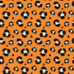 Leopard print pattern with black and white spots on an orange background, creating a bold and exotic design