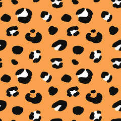 Leopard print pattern with black and orange spots on a tan background, creating a bold and exotic design