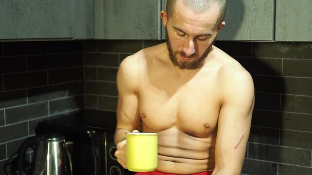 Young attractive man drinking coffee in the morning.